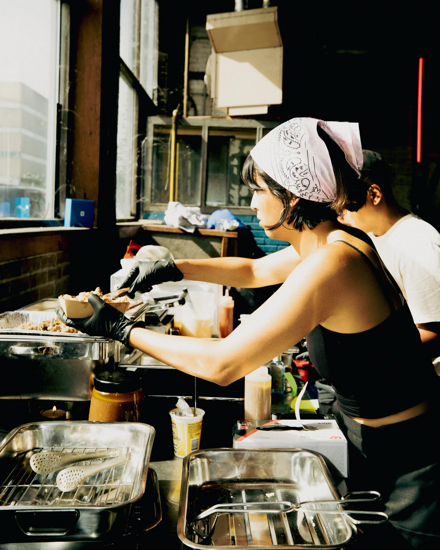 Food preparation at the Hapjesfestijn 2025 stall